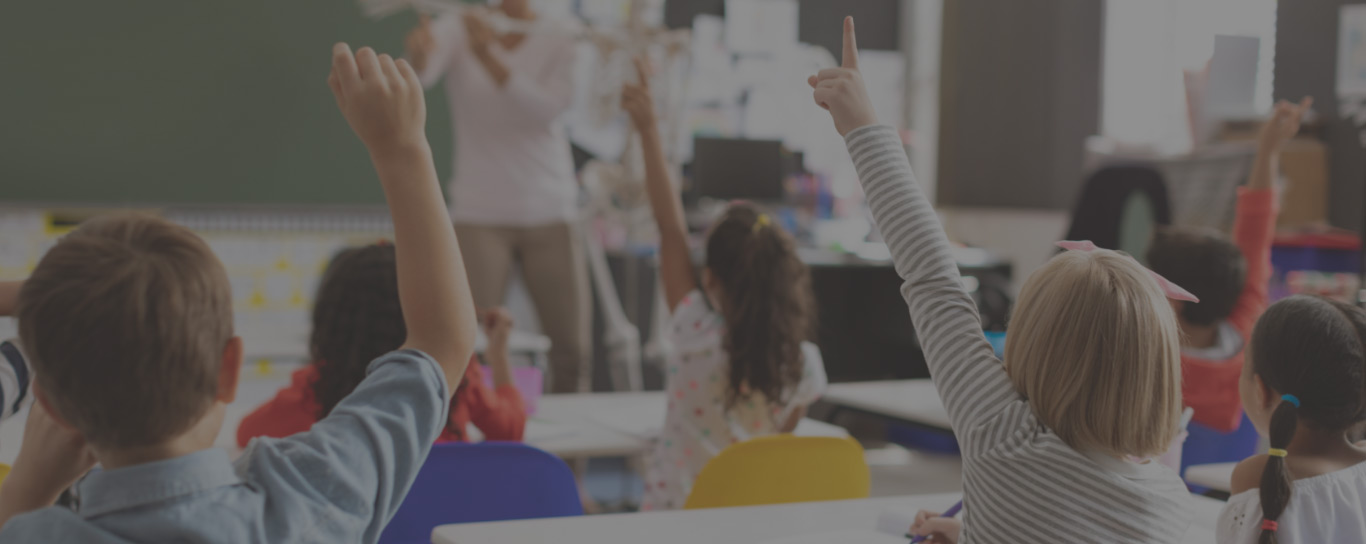 Ignite Achievement Academy Charlotte NC Children raising hands in classroom